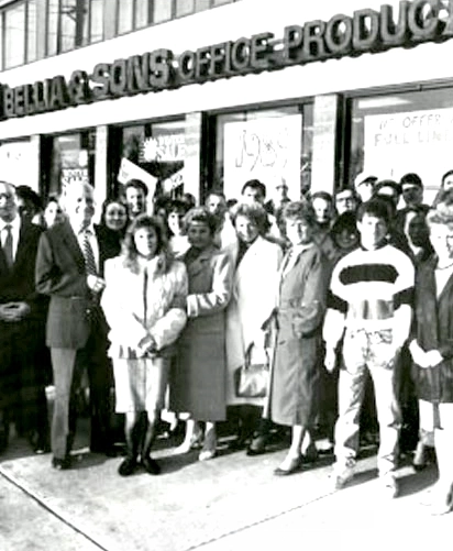 Salvatore Bellia with family and friends in front of new Bellia and Sons store location, 1989